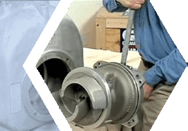 Technician handling a rotating pump assembly