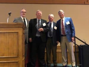 David Steblein presents Tim Weber with the Distributor eagle Award, with Henry Ritchie and Ed Pearce